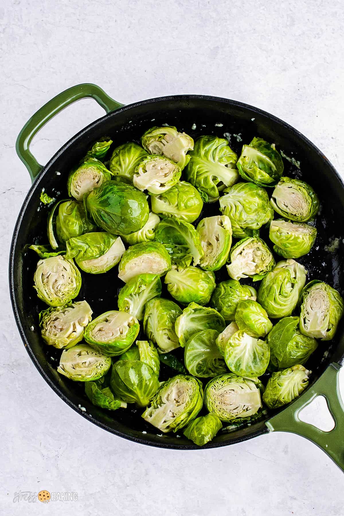 Brussels sprouts sliced in half in a skillet