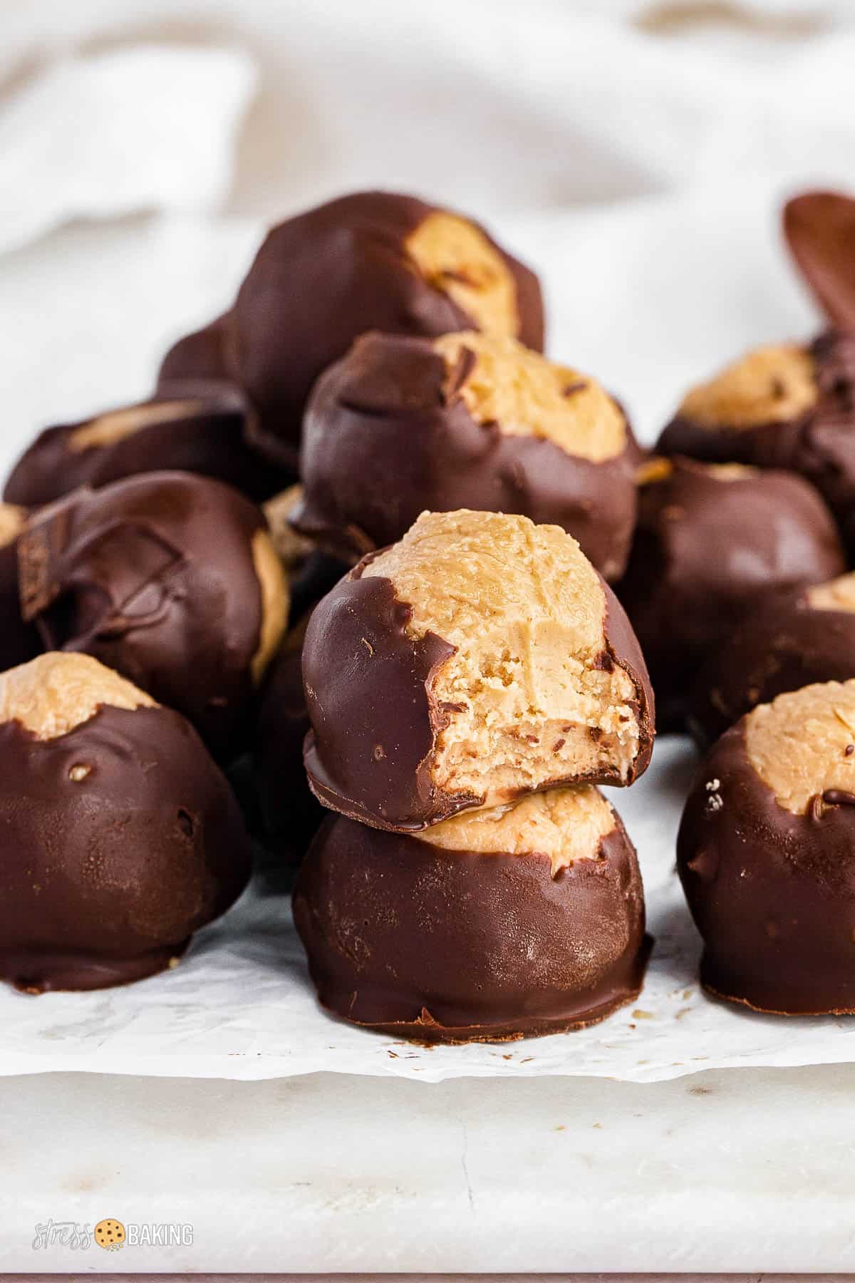 Stacks of buckeye balls on parchment paper