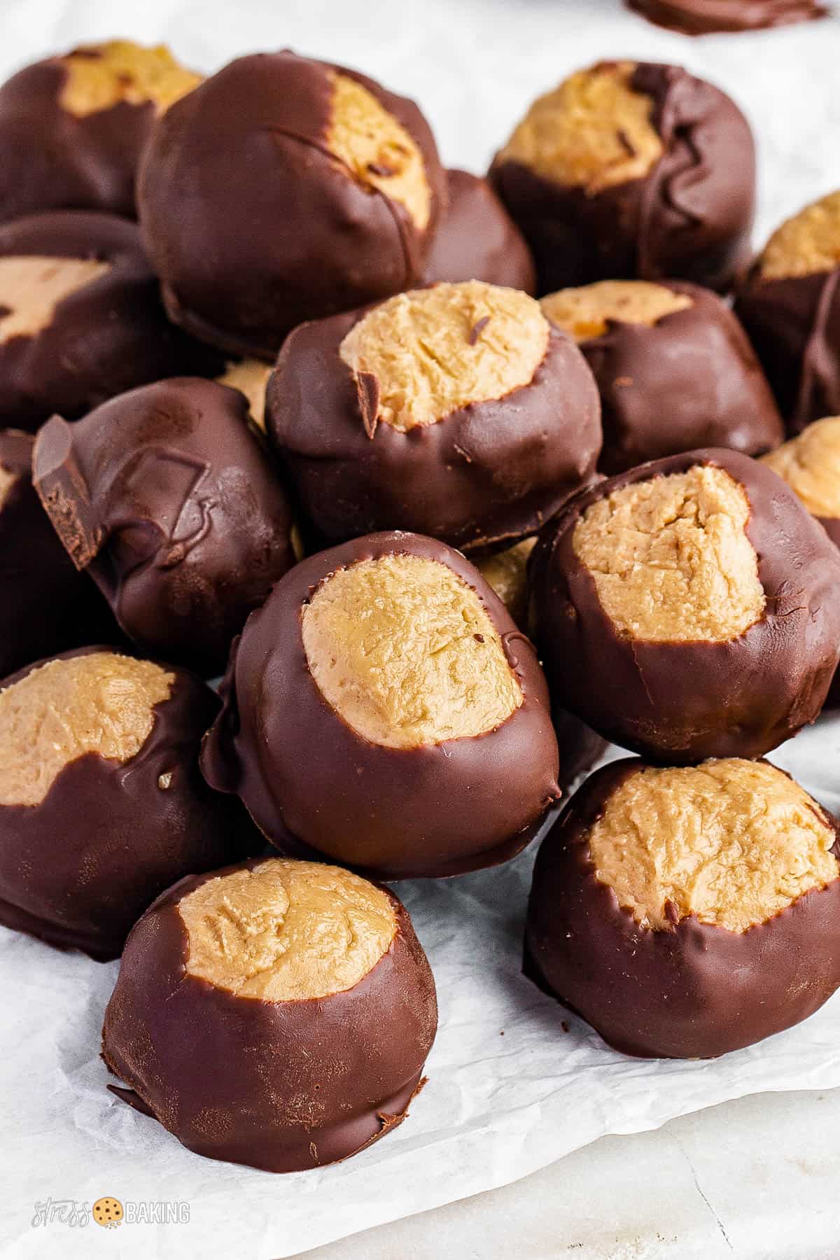 A pile of buckeye balls on parchment paper