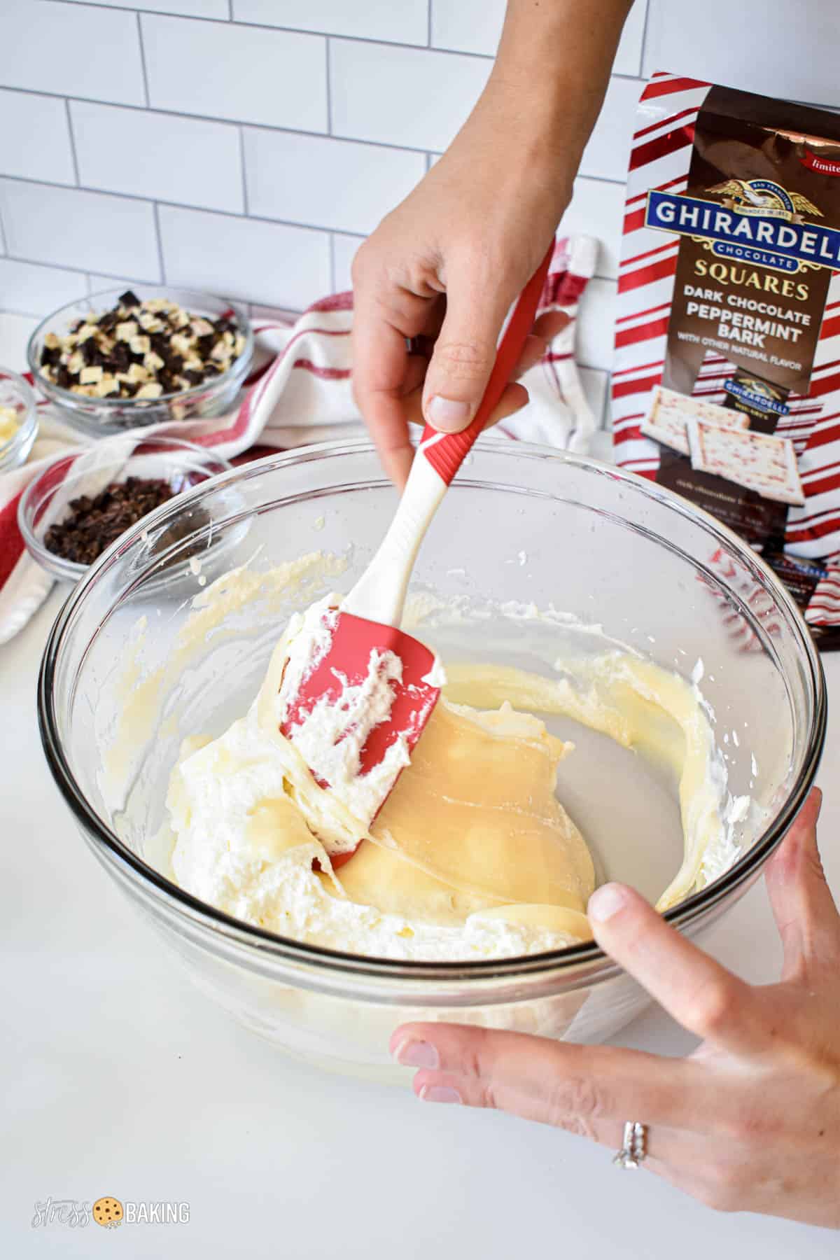 Whipped cream being folded into sweetened condensed milk