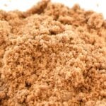 Clumped hardened brown sugar in a clear mixing bowl