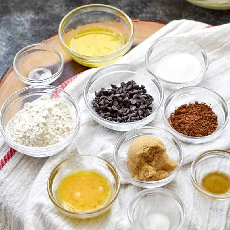 Ingredients for double chocolate chip cookies in small bowls