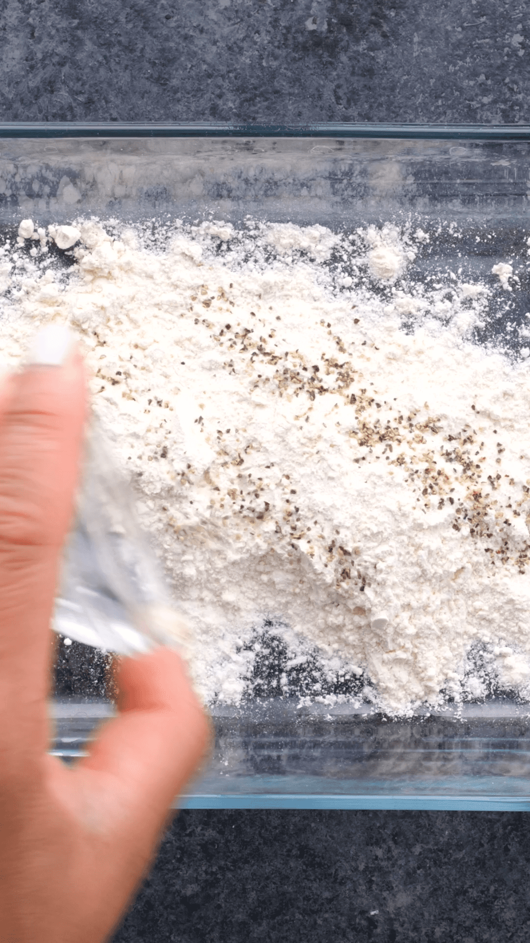 Mixing together a flour mixture in a clear dish