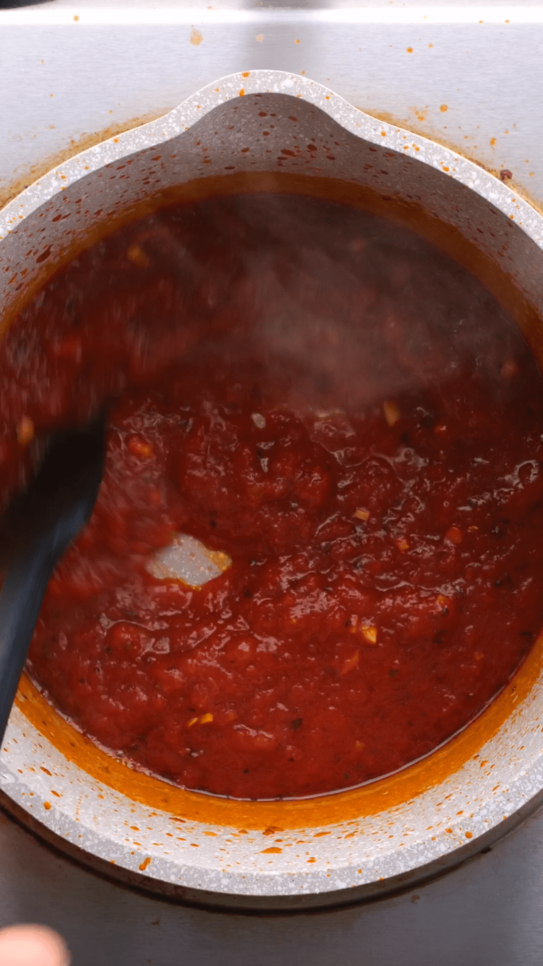 Marinara sauce being made on a stovetop