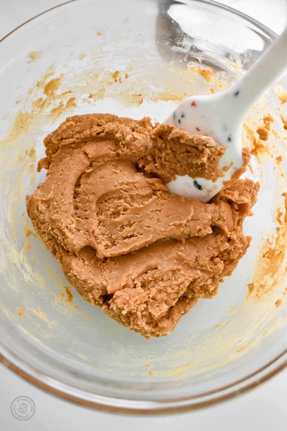 Peanut butter cookie dough in a small mixing bowl