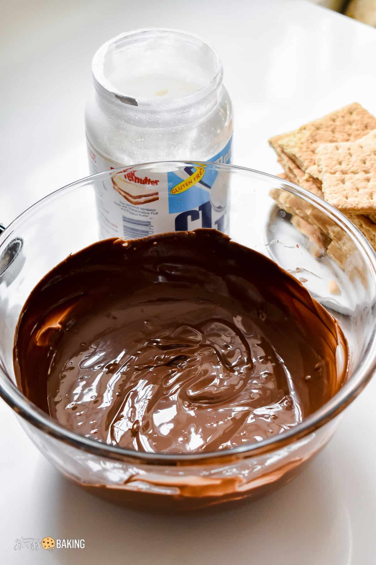 Melted chocolate in a clear mixing bowl