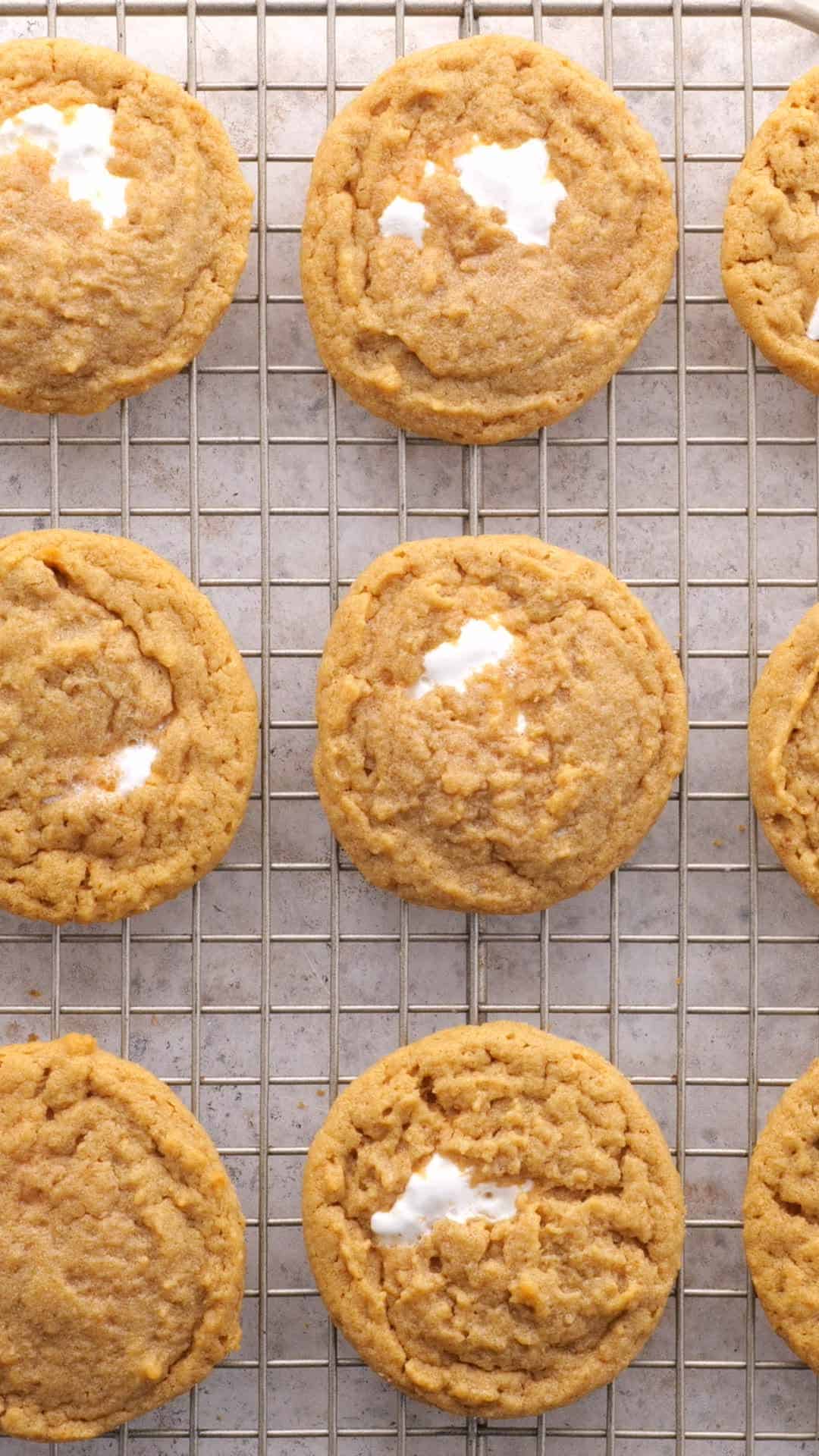 Peanut butter and marshmallow fluffernutter cookies on a wire rack