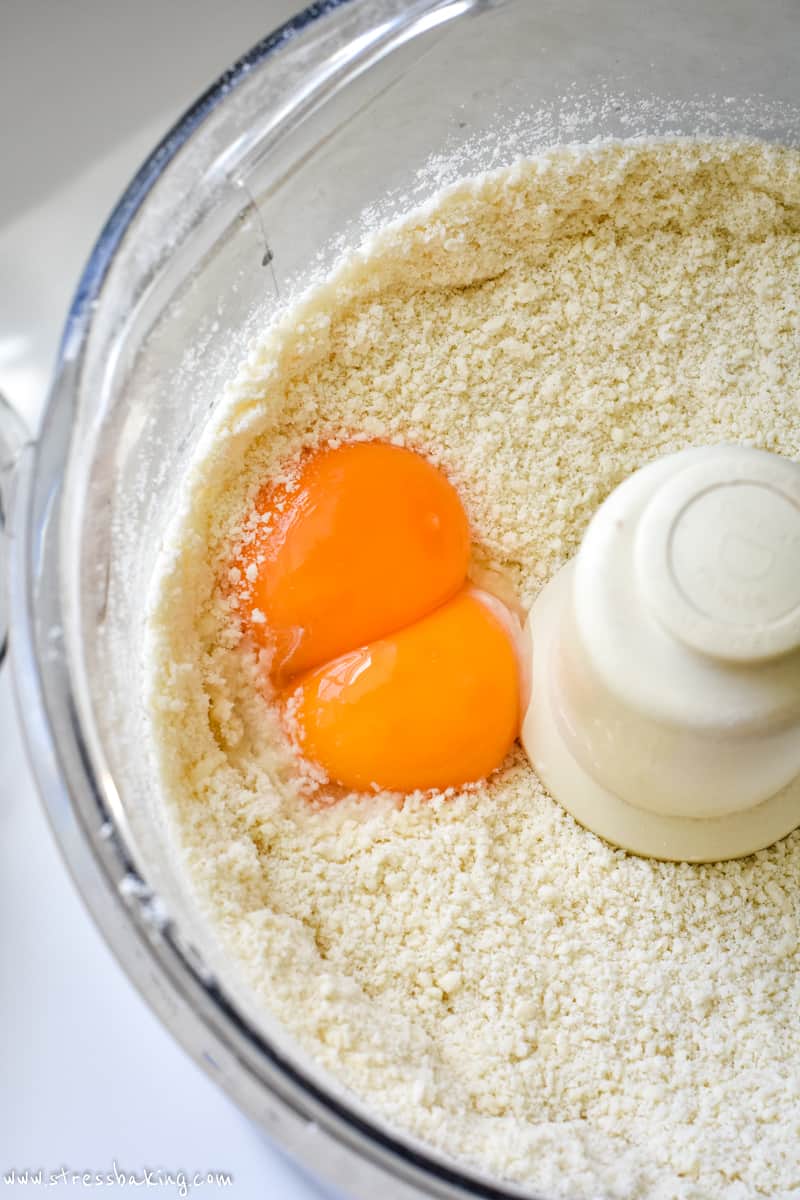 Almond flour mixture and eggs in a food processor