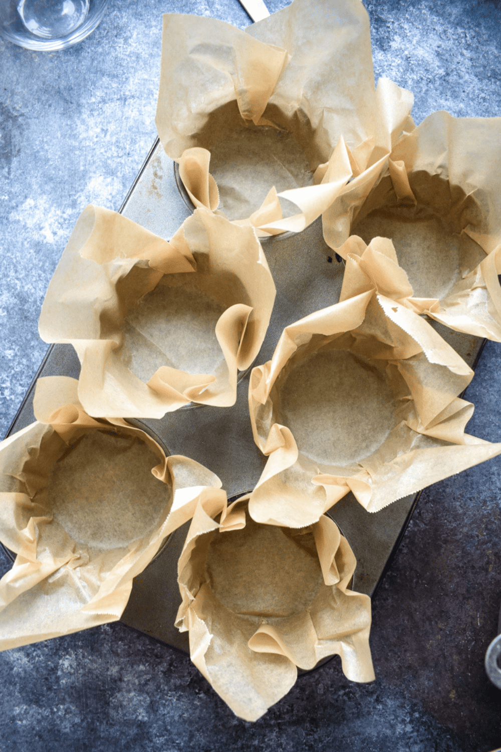 Parchment paper stuffed into jumbo muffin pan tins