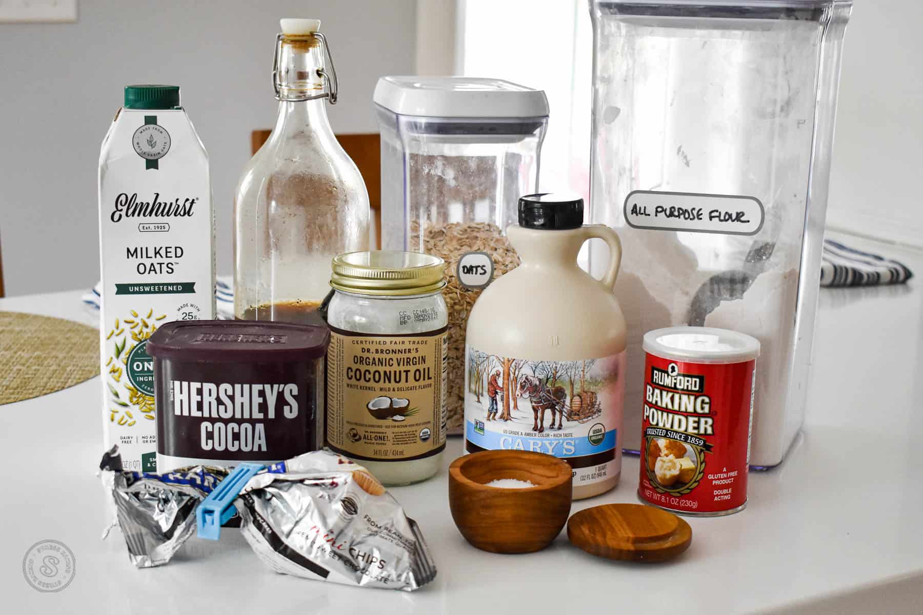Ingredients for chocolate baked oatmeal on a white counter